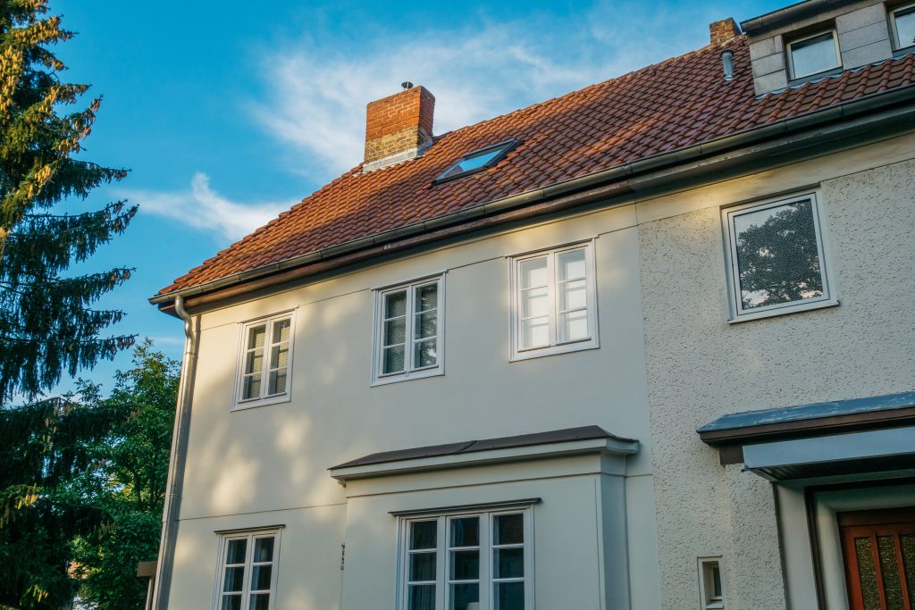 Exterior of a two story house with a chimney